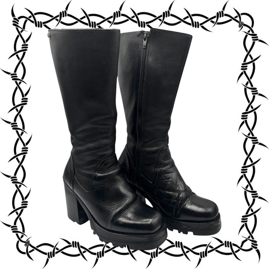 Black leather boots with a barbed wire border