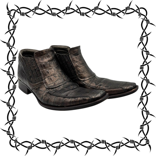 Pair of brown leather boots with a barbed wire border